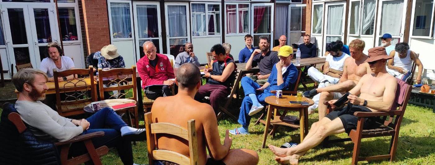 Men talking in a garden